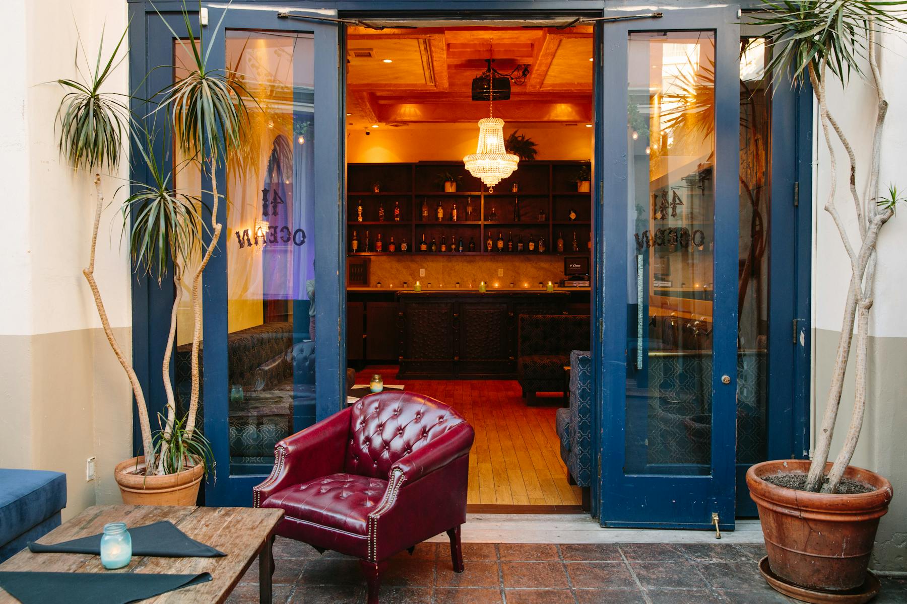 a large red chair in front of a window